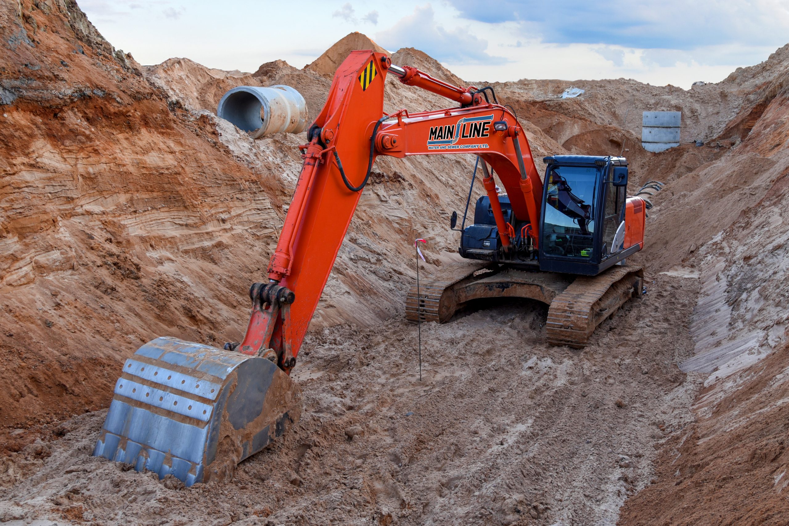 Excavator,Working,At,A,Construction,Site,During,Laying,Or,Replacement